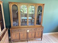 Front view of complete china cabinet showing doors and drawers