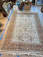Full view of the 72" x 103" floral area rug showing overall pattern and border