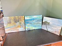 All three paintings side by side