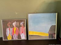 Both framed paintings side by side
