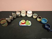 Full lot lineup showing all ceramic pieces and measuring cups