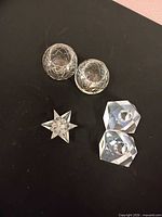 Group shot of all five cut glass pieces