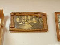 Rustic framed sepia saloon photograph on wall