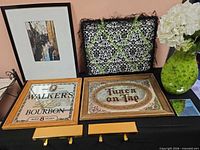 Group view showing framed print, pinboard, vase with hydrangeas, two mirrored bar signs and two gold hooks