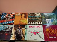 Eight record jackets laid out showing front cover art