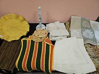 Full lot overview of linens, coasters, charger, paper towel holder