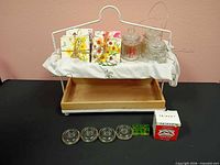 All items arranged on stand: coasters, jars, candle holders, tray, stand