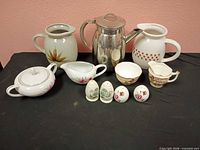 Group shot showing all 11 pieces: pitchers, stainless pot, covered bowl, gravy boat, creamer, sugar bowl, three shakers