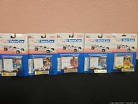 Group shot of all five sealed IndyCar diecasts on blister cards
