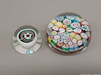 Both Murano millefiori paperweights front view
