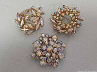 Front view showing all three brooches