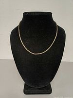 Necklace displayed on bust front view showing full length and link style