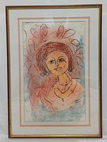 Full view of framed portrait under glass