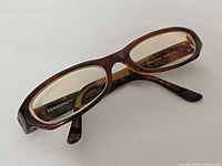 Angled view of tortoise Chanel eyeglasses highlighting frame and lenses