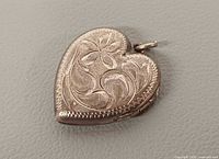 Front view of engraved sterling heart locket