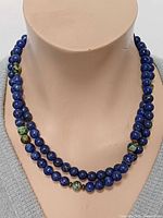 Necklace doubled on display bust showing lapis and turquoise beads