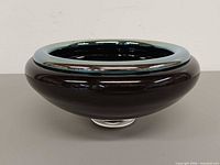 side profile showing bowl shape, rim color contrast, clear foot