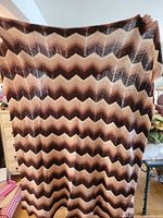 Chevron stripe afghan held fully open