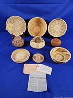 Group view of all nine handwoven baskets with tags visible