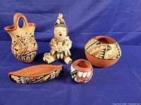 Group photo of all five Jemez pottery pieces