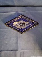 Camel Special Lights blue diamond-shaped ashtray showing design and wear