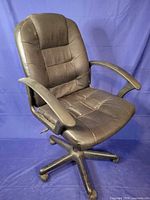 Full view of black faux leather office chair