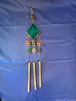 Green diamond wind chime with three brass tubes