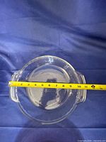 Clear glass baking dish measured across handles ~11 in.
