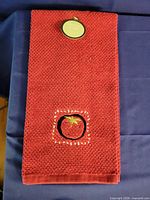 Red kitchen towel with embroidered tomato motif