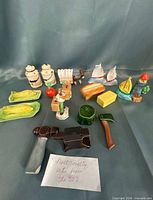 Group photo showing all fourteen novelty ceramic salt & pepper shakers