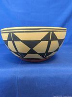 Side view showing tan exterior with black geometric design