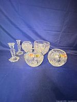 Full set: four bowls and two candlesticks on blue backdrop