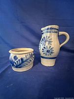 Front view of stoneware pitcher and crock showing cobalt decoration and overall form