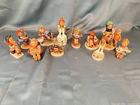 Group shot of all 12 Hummel figurines