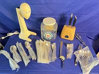 Overall lot including mixer base, Coors jar, flatware bundles, knife block with knives, beaters