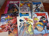All six comic books laid out front covers visible