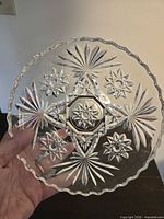 Close-up of one bowl showing Star of David pattern and scalloped rim
