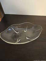 Top view of clear glass freeform oval serving dish showing shape and central well