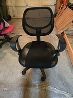 Front view of black mesh office chair with armrests, padded seat and five-caster base