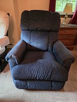 Front view of blue electric recliner chair upright