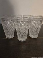 Front view of all seven hobnail tumblers