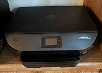 Closed view of HP Envy 5545 printer front and top