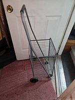Cart standing open showing basket and wheels