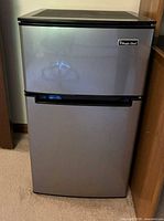 Front view of Magic Chef stainless-look mini fridge