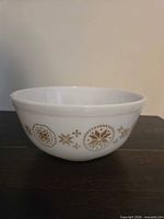 Side view of white Pyrex bowl with brown Town & Country pattern