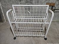 Front view showing two shelves and casters