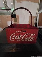 Front view showing Drink Coca-Cola script, red paint, wear