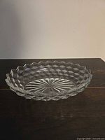 Oblique view of Fostoria America oval bowl showing cube pattern and sawtooth rim