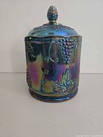 Front view of iridescent blue Harvest Grape canister with lid
