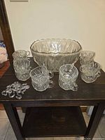 Punch bowl, 8 of 12 cups, hooks displayed front